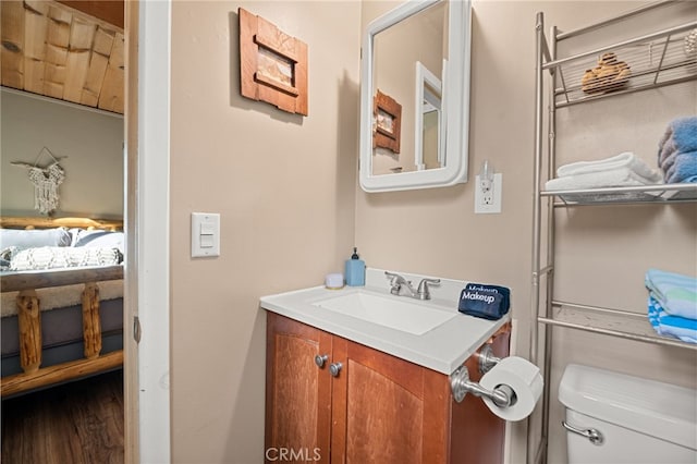 bathroom featuring vanity and toilet