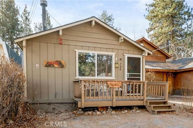 rear view of property with a deck