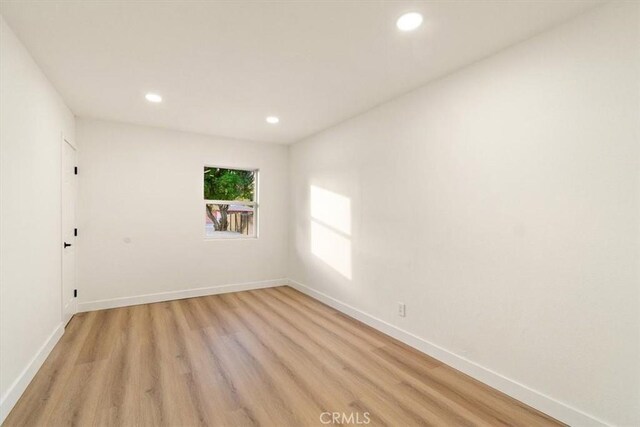 unfurnished room featuring light hardwood / wood-style floors