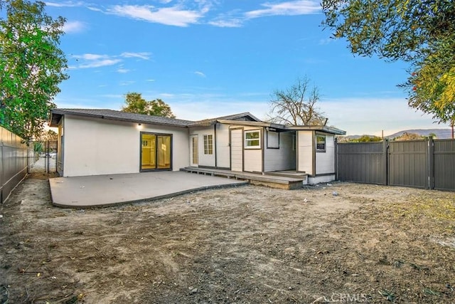 rear view of house featuring a patio