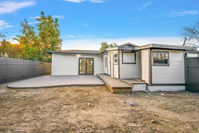 back of house with a patio area