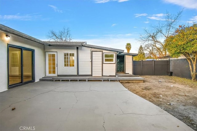 back of property featuring a patio