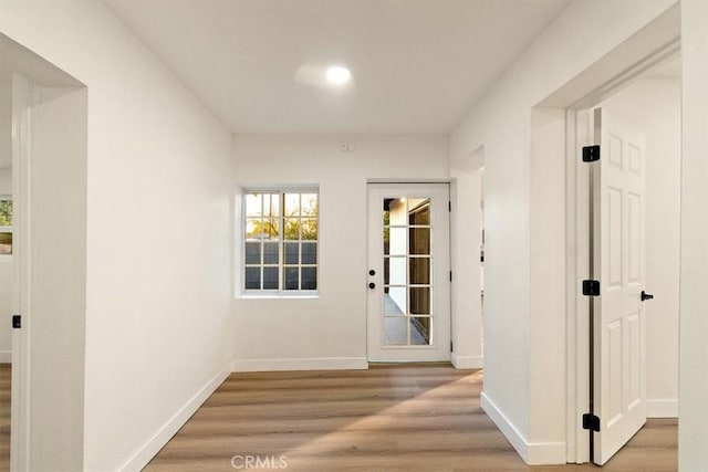 hallway featuring wood-type flooring