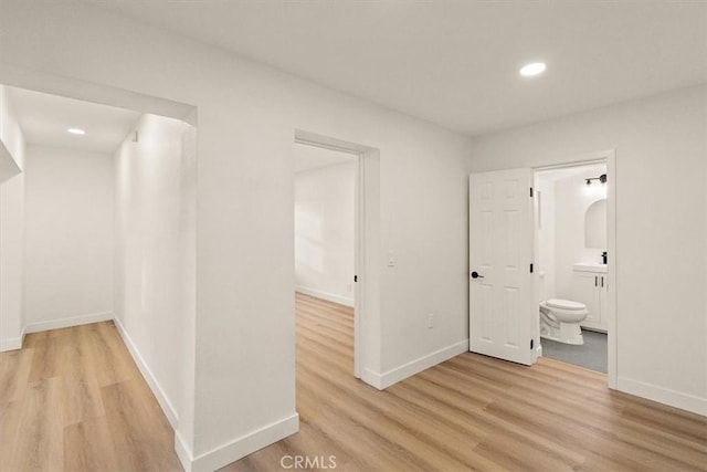 hallway with light wood-type flooring