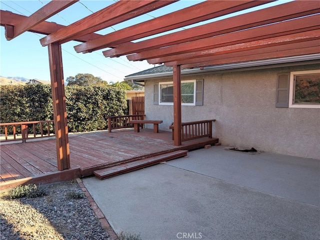 wooden terrace featuring a mountain view and a pergola