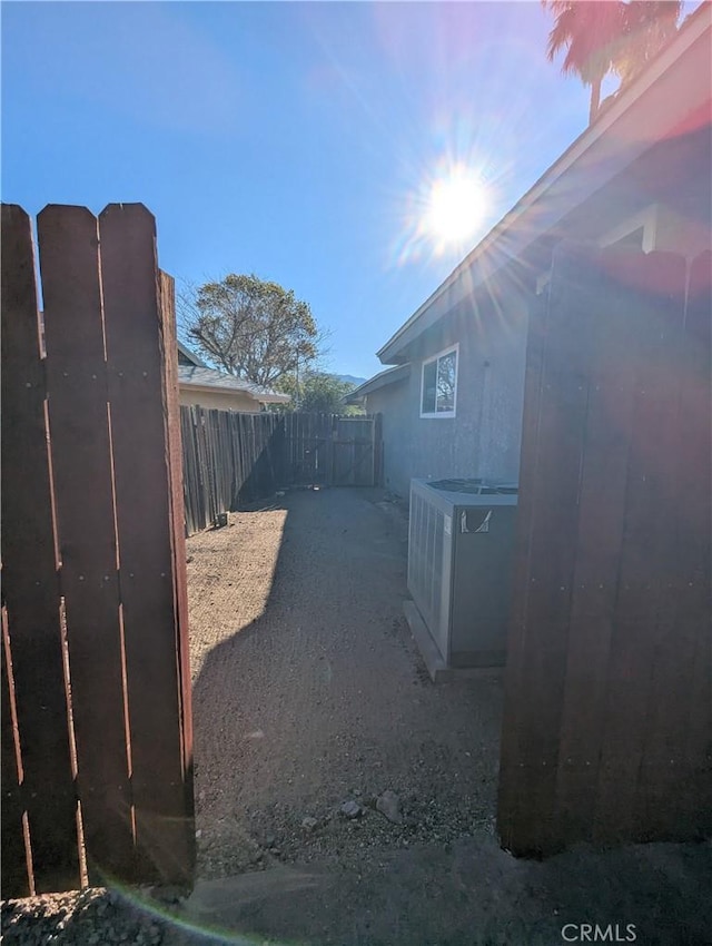 yard at dusk with central AC unit