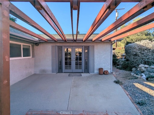 view of patio / terrace featuring french doors and a pergola