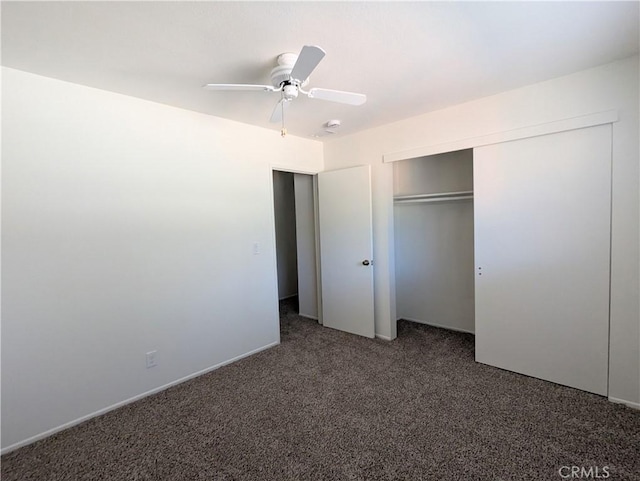 unfurnished bedroom with a closet, carpet floors, and ceiling fan