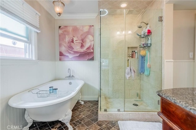 bathroom featuring ornamental molding, independent shower and bath, and vanity