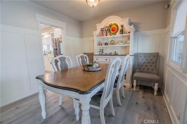 dining area featuring light wood-type flooring