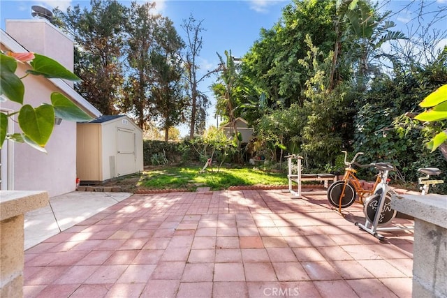 view of patio featuring a shed