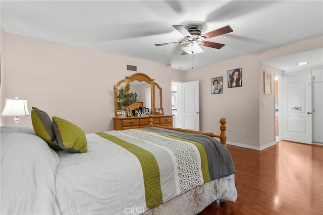 bedroom featuring wood-type flooring and ceiling fan