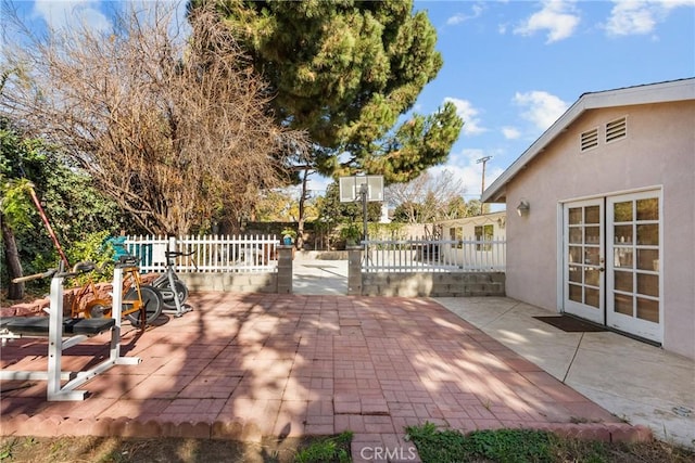 view of patio featuring french doors