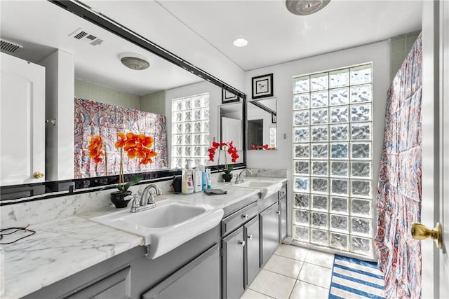 bathroom featuring tile patterned flooring and vanity