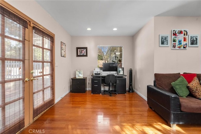 office space featuring hardwood / wood-style flooring and french doors