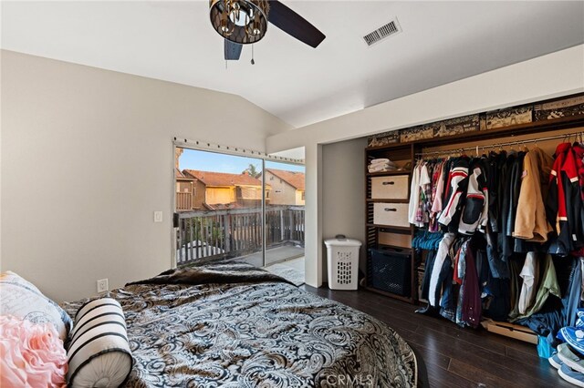 bedroom with lofted ceiling, dark wood-type flooring, visible vents, a ceiling fan, and access to outside