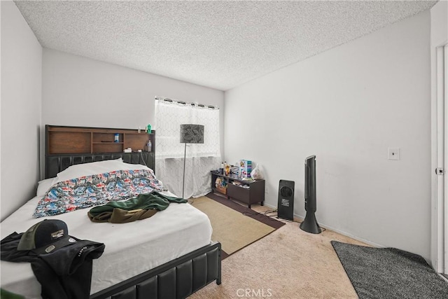 carpeted bedroom with a textured ceiling