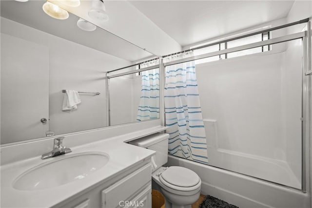 full bathroom featuring toilet, vanity, and tub / shower combination