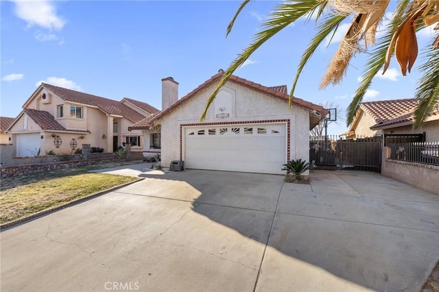 view of front of home featuring a garage and a front lawn