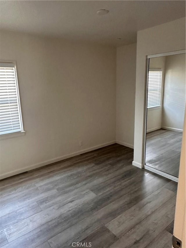 spare room with hardwood / wood-style flooring