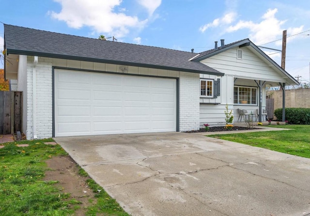 single story home with a garage and a front yard