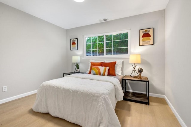 bedroom with wood-type flooring