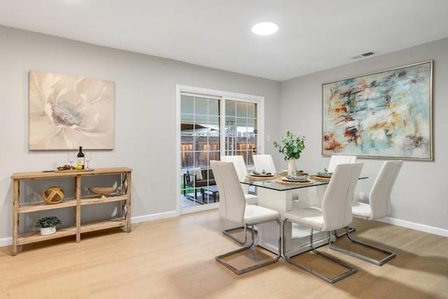 dining area with hardwood / wood-style flooring