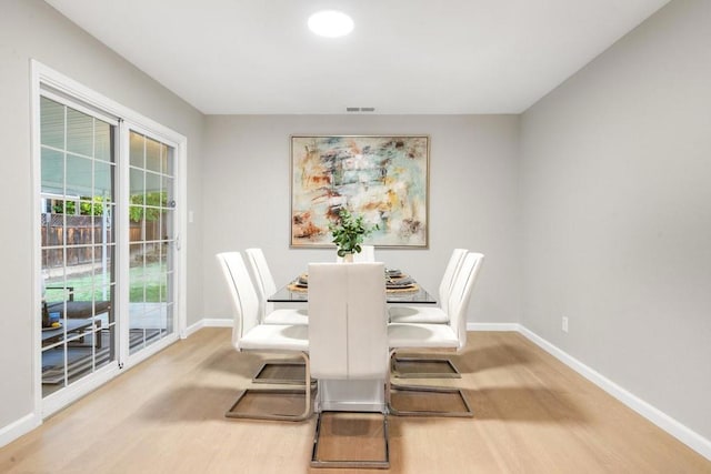 dining room with hardwood / wood-style flooring