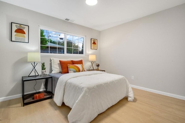 bedroom featuring wood-type flooring