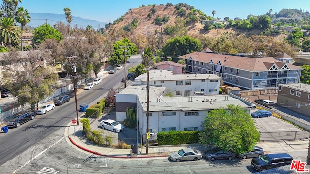 birds eye view of property featuring a mountain view