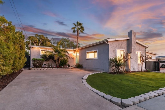 view of front of home with a yard