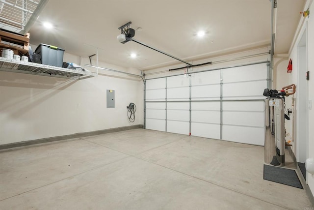 garage with a garage door opener and electric panel