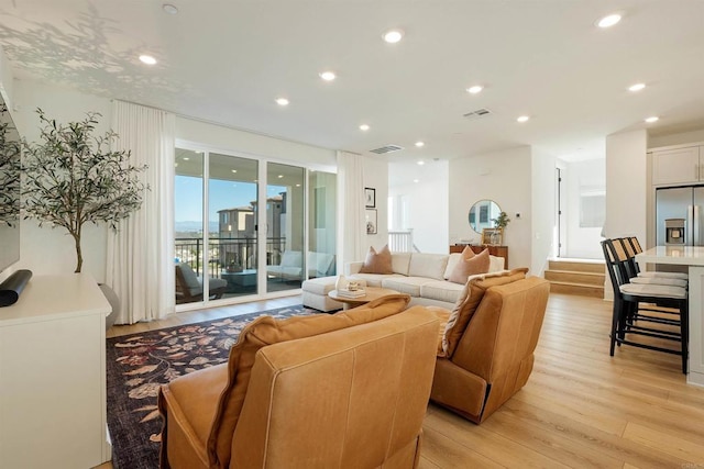 living room with light hardwood / wood-style floors