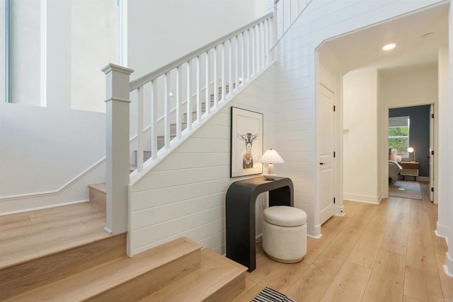 stairs featuring hardwood / wood-style flooring