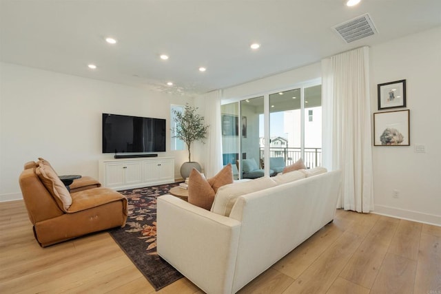 living room with light hardwood / wood-style floors