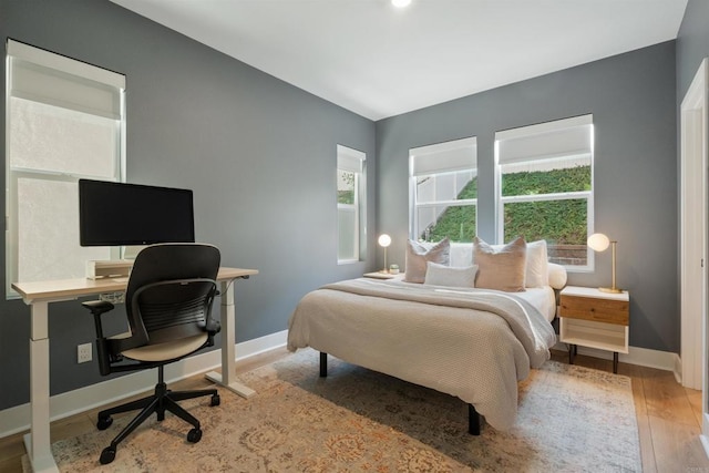 bedroom with light hardwood / wood-style flooring