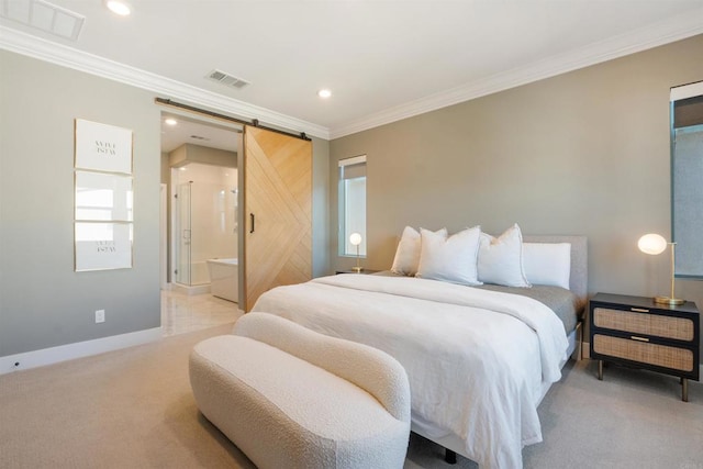 carpeted bedroom with a barn door, connected bathroom, and ornamental molding