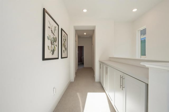 hallway with light carpet