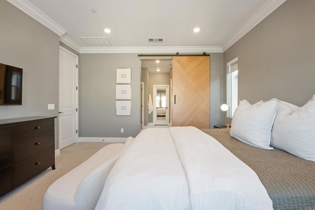 carpeted bedroom with a barn door and crown molding