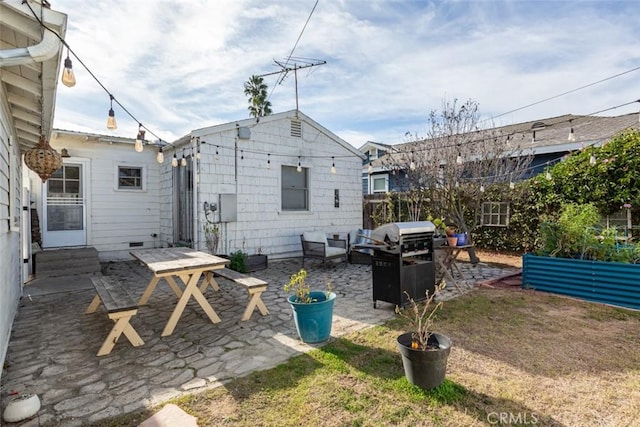 back of property featuring a patio area