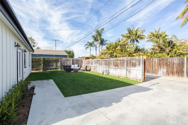 view of yard with an outdoor living space and a patio area