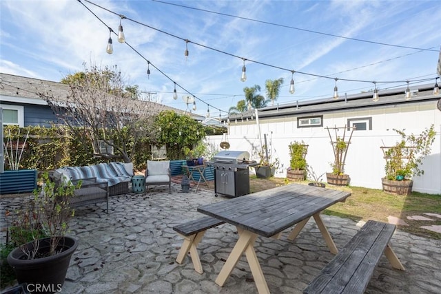 view of patio / terrace featuring an outdoor living space and a grill