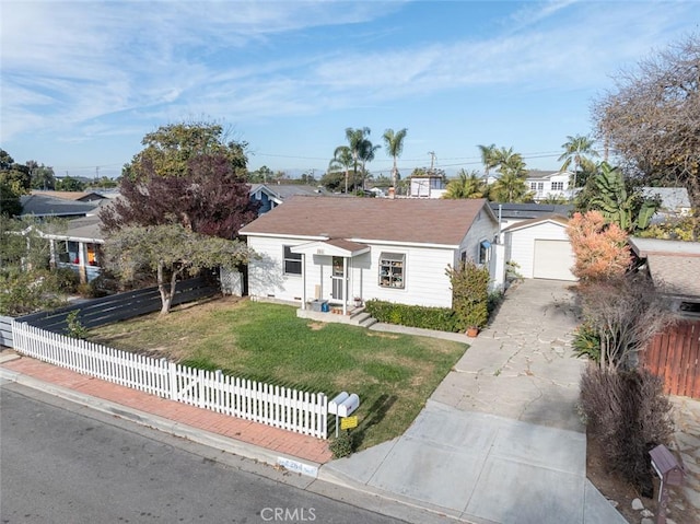 ranch-style home with a garage, an outdoor structure, and a front yard