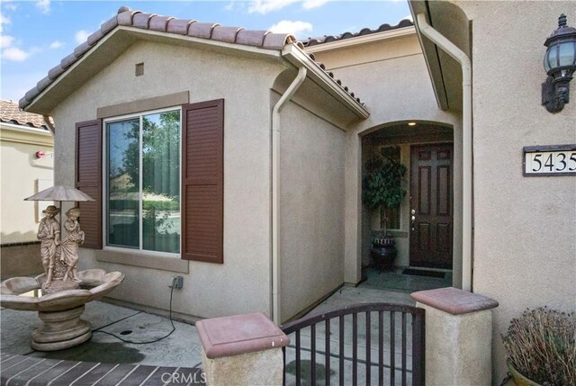 property entrance with a patio