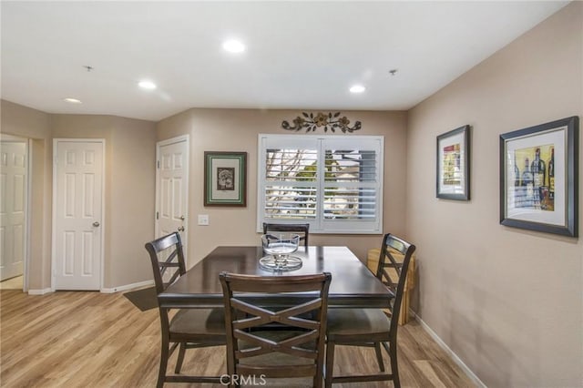 dining space featuring light wood-type flooring