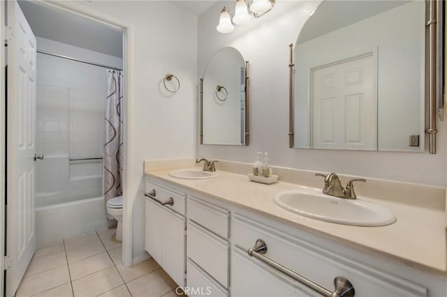 full bathroom featuring shower / bath combo with shower curtain, toilet, vanity, and tile patterned flooring