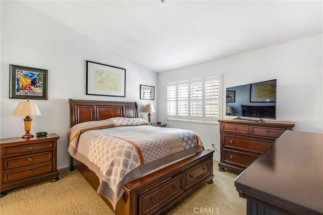 carpeted bedroom featuring vaulted ceiling