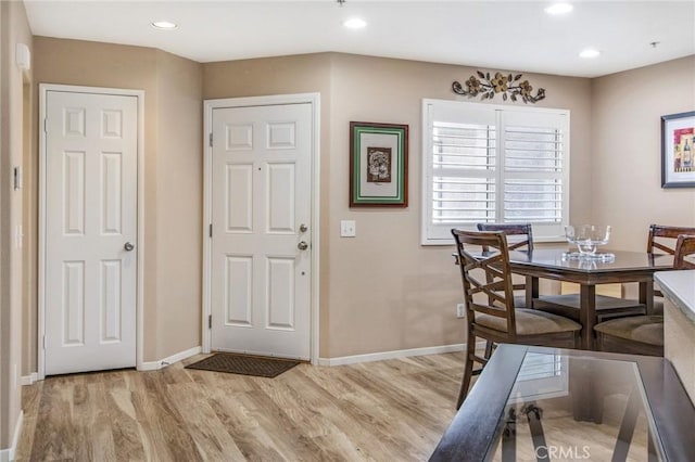 dining area with light hardwood / wood-style floors