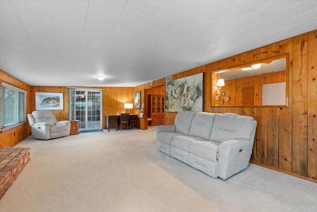 carpeted living room featuring a wealth of natural light