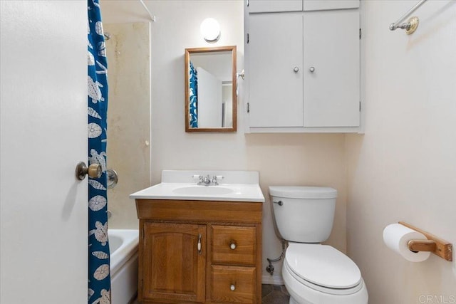 bathroom featuring toilet and vanity